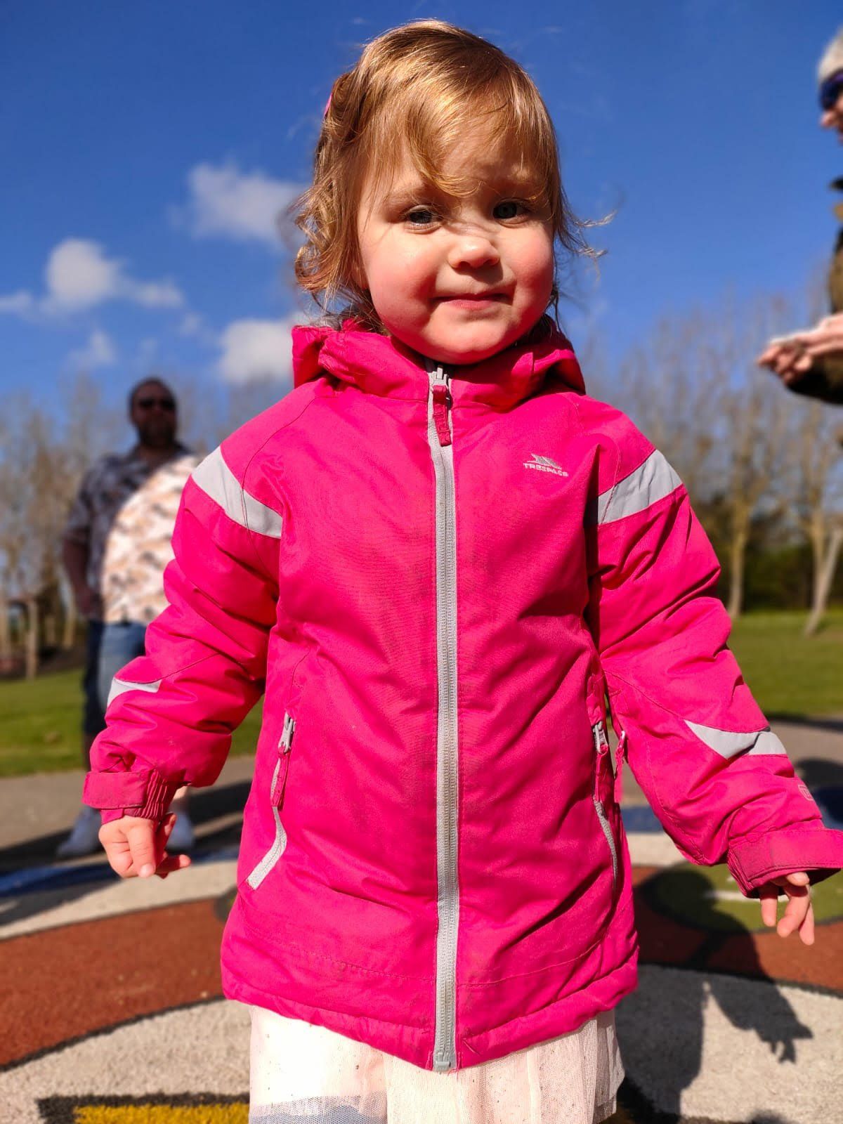 Young girl in a pink coat