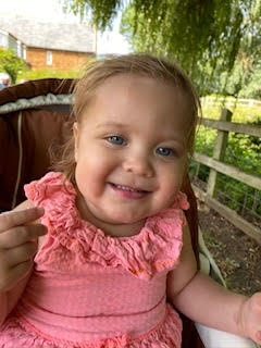 Smiling young girl in pink